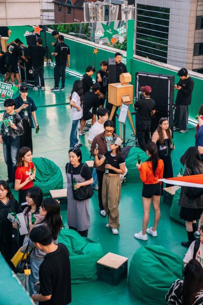 People attending rooftop party by Heineken