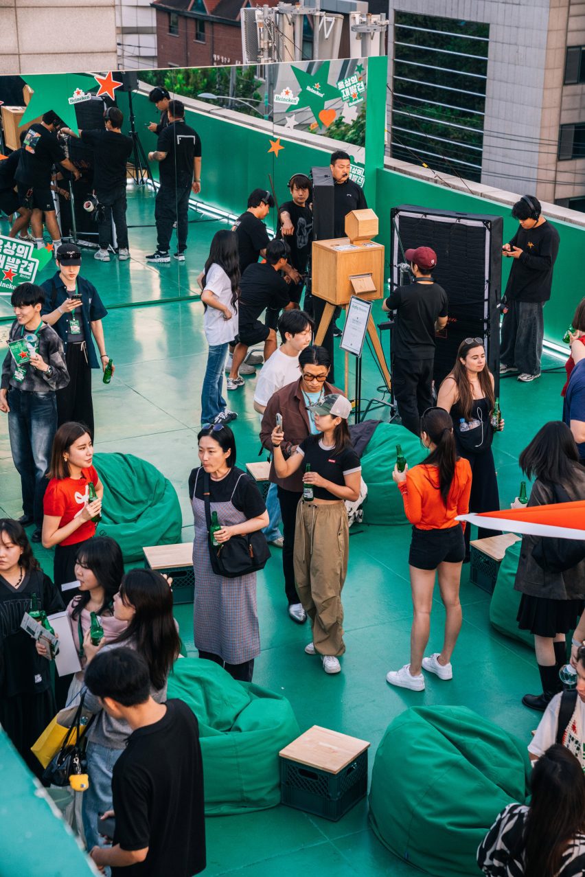 People attending rooftop party by Heineken