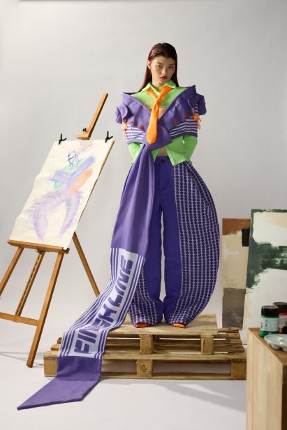 a photograph of a person in a purple garment