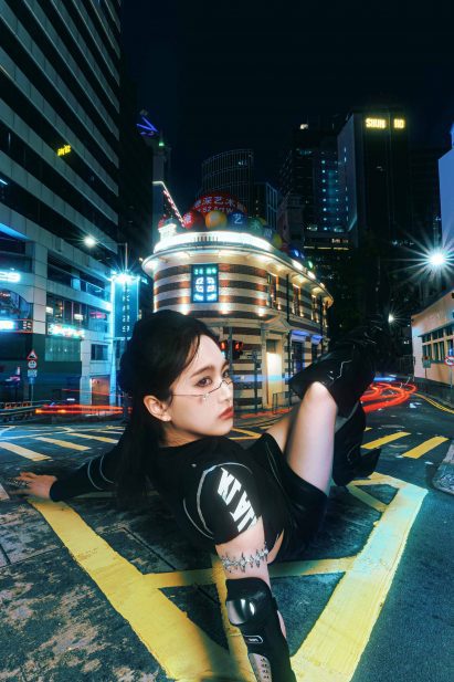 an image of a person in front of city buildings