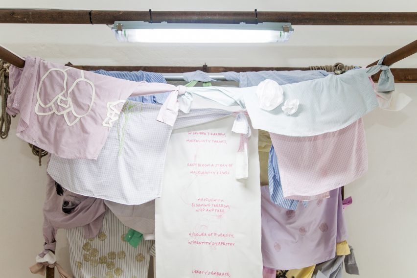a photograph of student work, displaying hanging fabrics