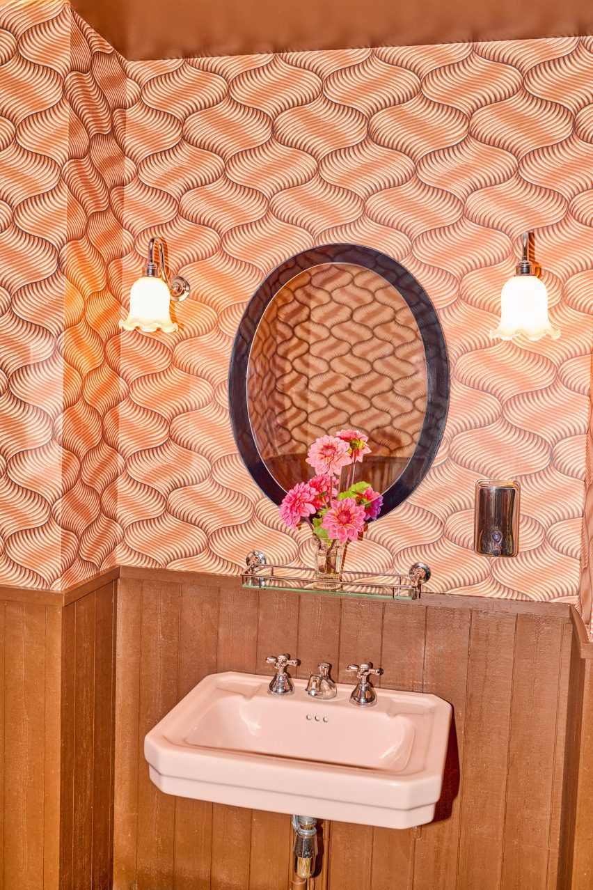 Bathroom with pink wallpaper