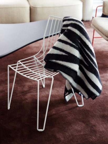 Black-and-white blanket on white chair