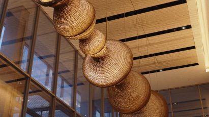 Large hanging light sculpture suspended in the lobby of Shard Place