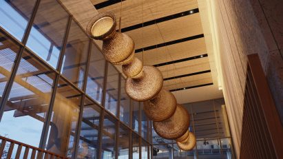 Large hanging light sculpture suspended in the lobby of Shard Place