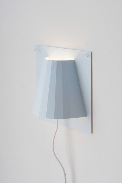 a photograph of a blue wall light
