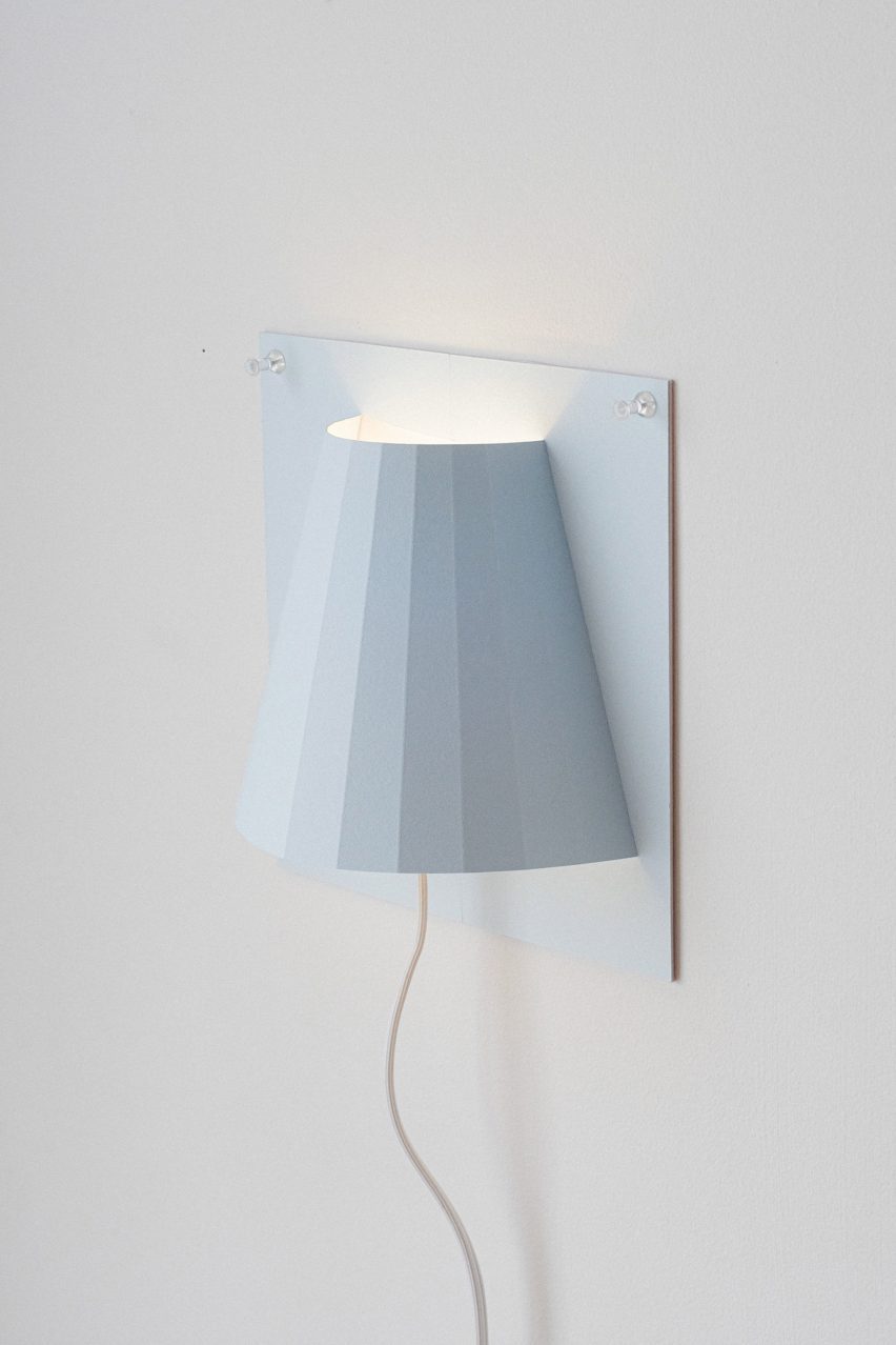 a photograph of a blue wall light