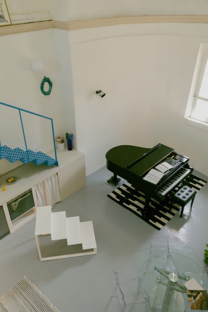 Piano and staircase in Pailunga converted chapel by Atelier Vago