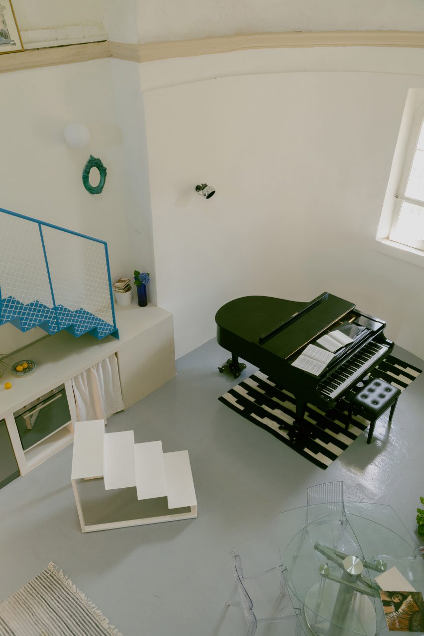 Piano and staircase in Pailunga converted chapel by Atelier Vago