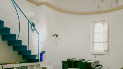 Piano, staircase and apse in Pailunga converted chapel by Atelier Vago
