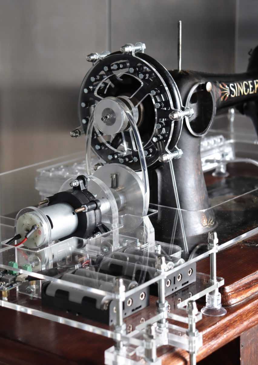 Close-up photo of the fly wheel on a modified Singer treadle sewing machine