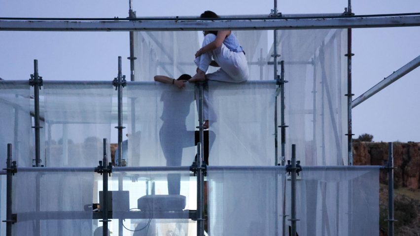 a photograph of people on scaffolding