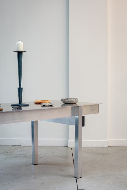 Table with trinket dishes and candle holder