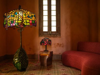 Sculptural lamps by Autumn Casey softly illuminate a russet-toned space