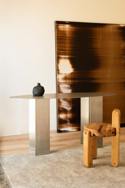 Wooden stool next to metal table
