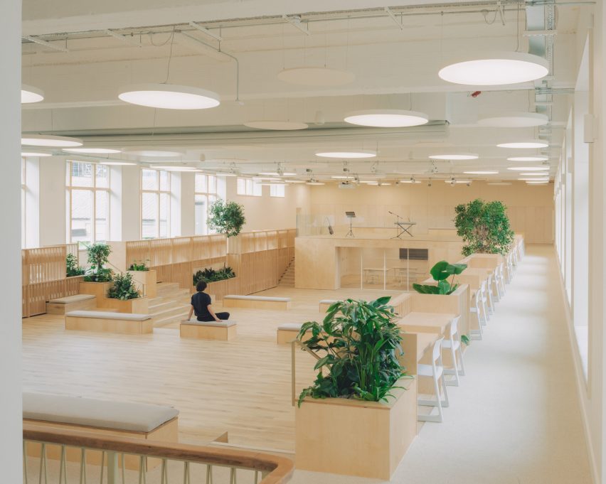 Person sitting on bench in educational building