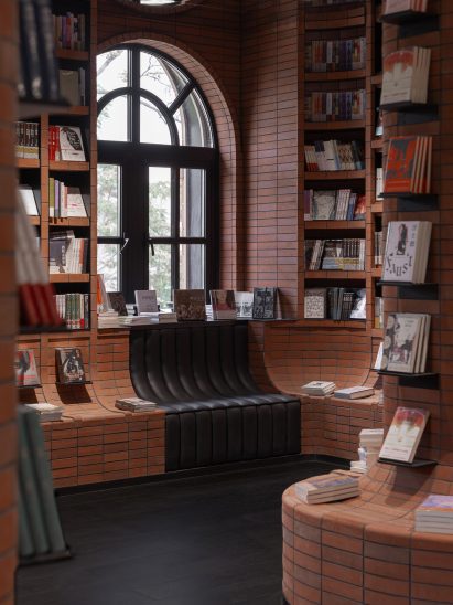 Brickwork in the bookstore by X+Living