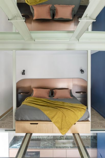 Bedroom with metal headboard in RA House by StudioTamat