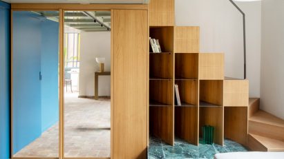 Glass floor and bookshelf staircase in RA House by StudioTamat