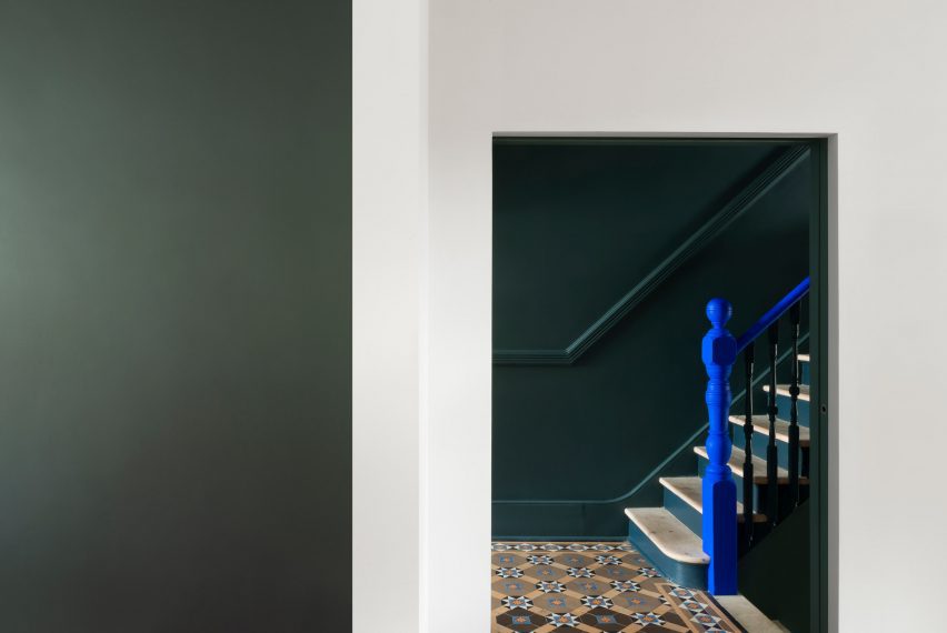 Bright blue bannister staircase