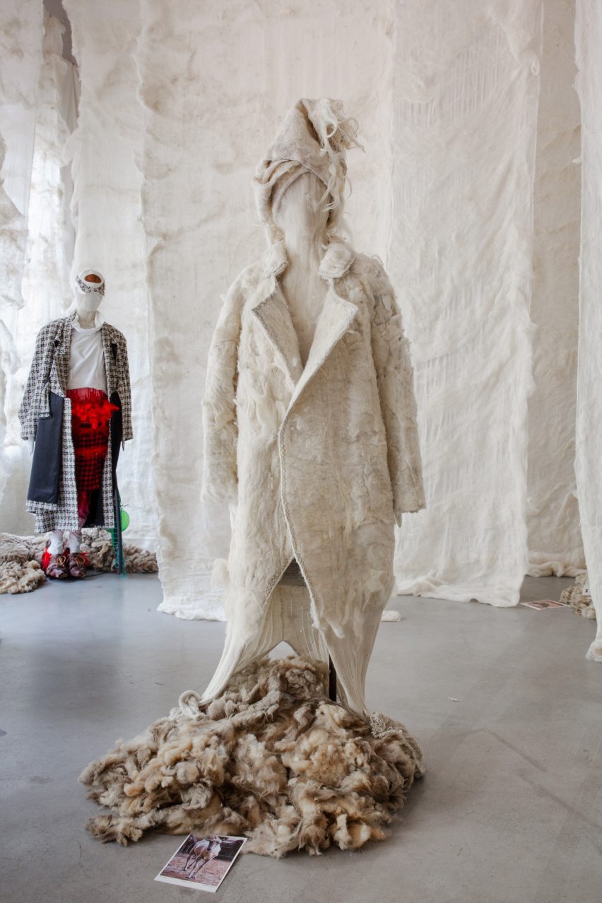 Photo of an off-white elaborate felted wool coat and headpiece by Collectie Arnhem