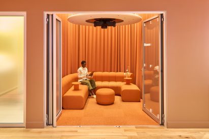 Completely orange room behind open folding doors