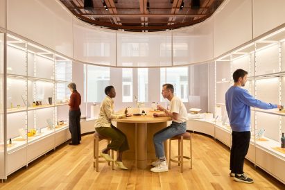 A retail space where products are displayed on modular shelving