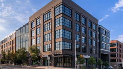 Grey brick structure on corner of city block