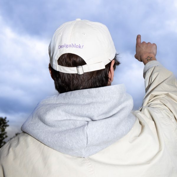 Photo of a person wearing a Designblok cap
