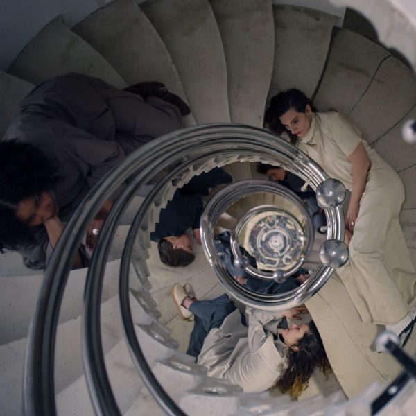 Photo of people sat in a spiral staircase