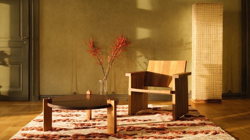 Photo of a wooden chair and table on a rug