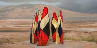 AI-generated monument comprising five upright structures with gold, black and red-coloured facets
