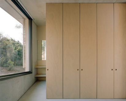 Bedroom interior at concrete home