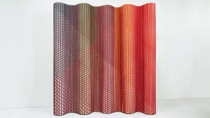 Plissade, a textile-based room divider, in green, blue and red