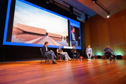 Dezeen's Max Fraser moderating a talk on luxury residential design