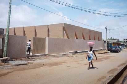 Street view of public sports facility by DeRoche Projects