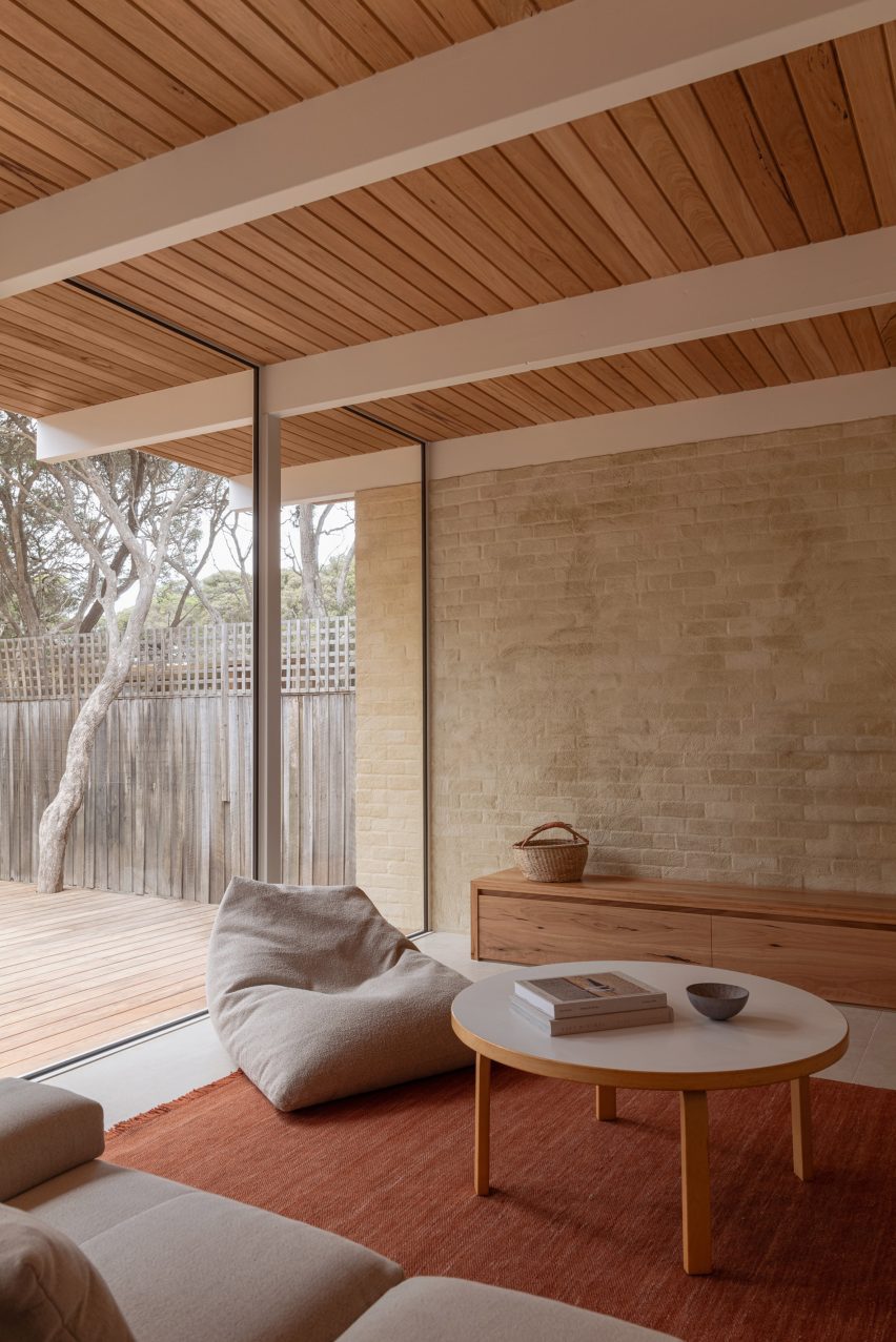 Living space timber ceiling and brick wall