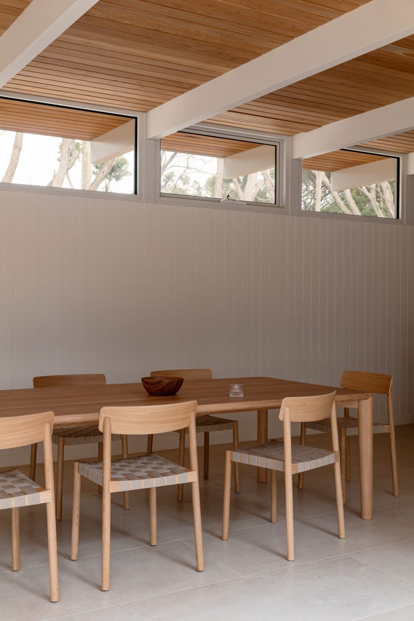 Dining area with white wood panelling