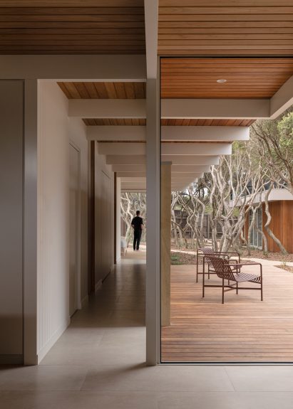 L-shaped house with large windows