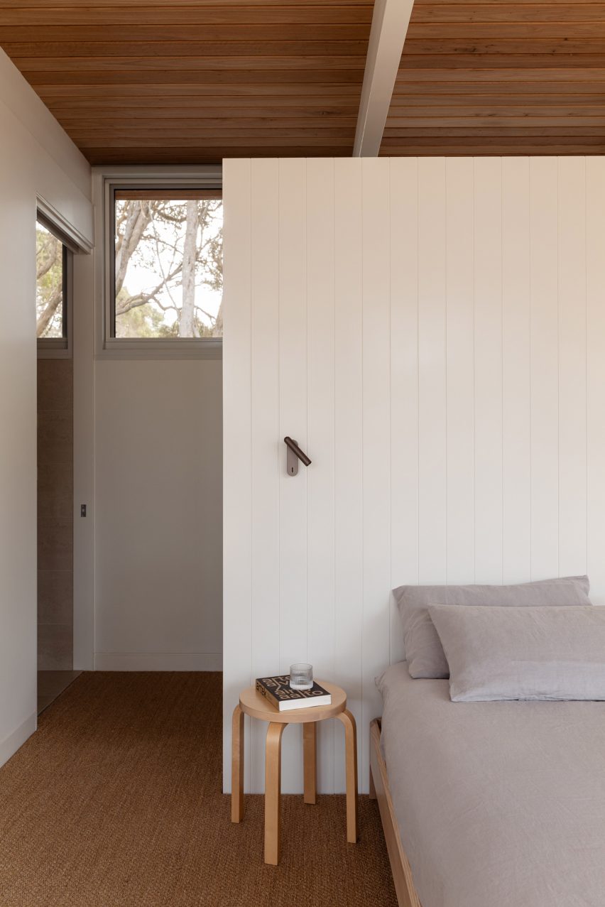 Bed with wood panelling details