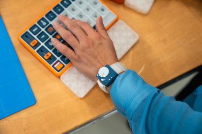 Person typing on a large keyboard