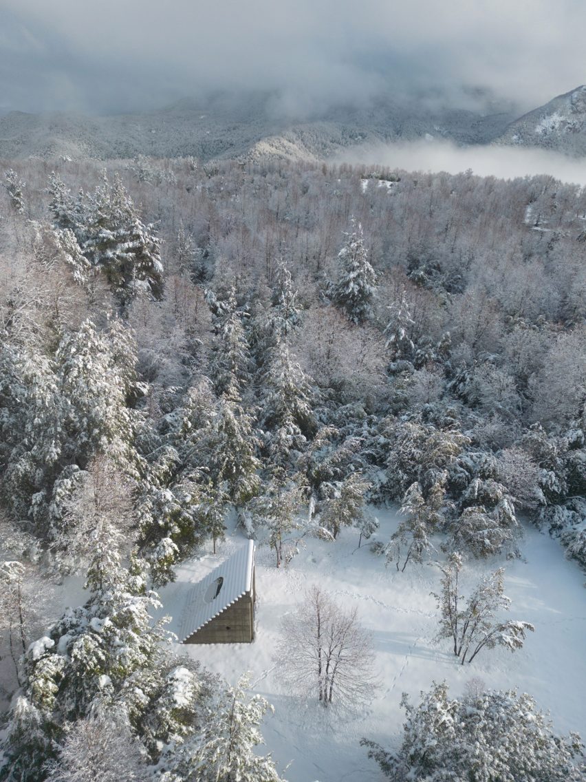 Aerial view Miel Pavilion by Pezo von Ellrichshausen in forest clearing