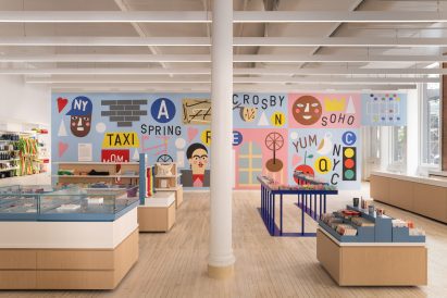 A site-specific mural titled LOVE NYC by Nina Chanel Abney covers the back wall of a store