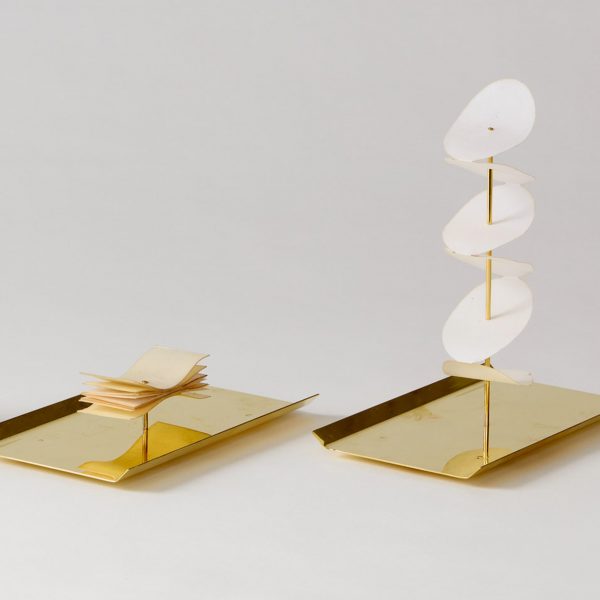 brass and wax paper candles