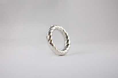 a photograph of a silver ring