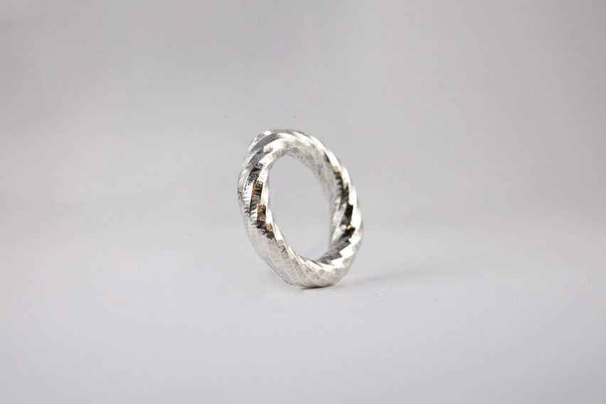a photograph of a silver ring