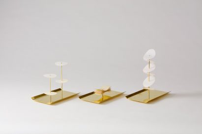 a series of gold and white ornaments