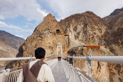 White-steel suspension bridge in Tibet