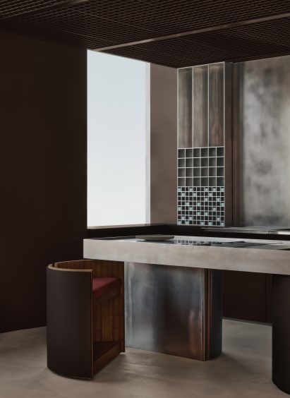 A boutique featuring metal surfaces and matte-brown elements