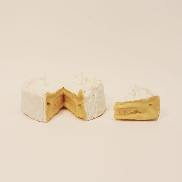 a replica of brie as a candle